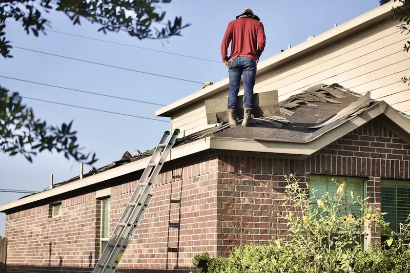 Professional roofer working on a residential roof in Blue Oaks